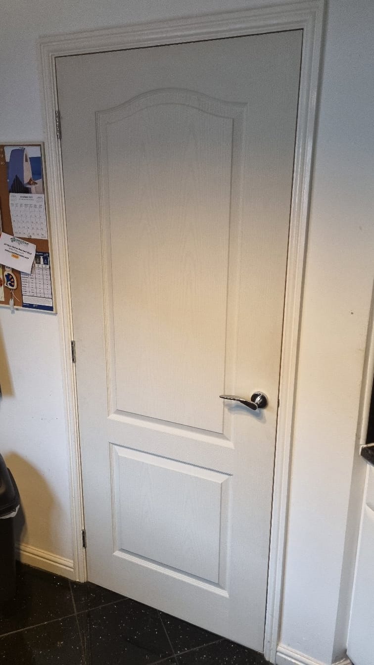 Professional Joiner Installing Doors in Lancashire